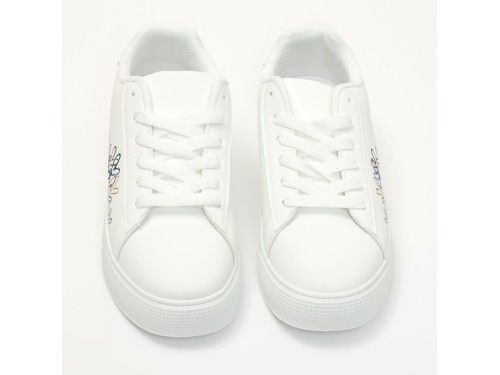 Sneakers in simil pelle con ricamo laterale